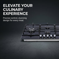 Midea 90cm gas-on-glass hob cooking a sauce beside chopped herbs, with copper pans hanging above