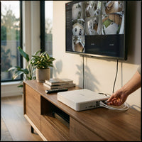 Hikvision DS-7108NI-Q1/8P NVR connected to a wall-mounted TV showing camera feeds