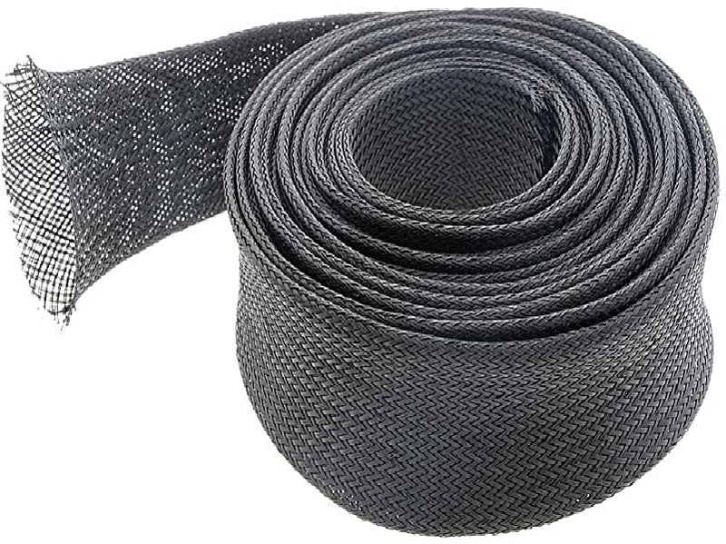 Black 65mm braided cable sleeve coiled in a loose loop on white background