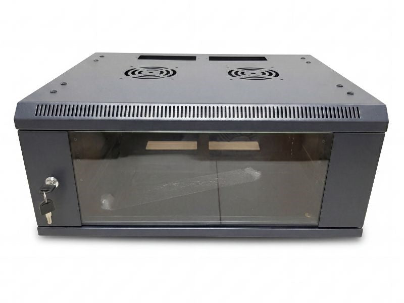 Zatech 4U wall-mount server cabinet closed on a desk beside dual monitors and a laptop